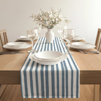Minimalist slate blue stripe table runner adding a contemporary touch to a neutral dining setting