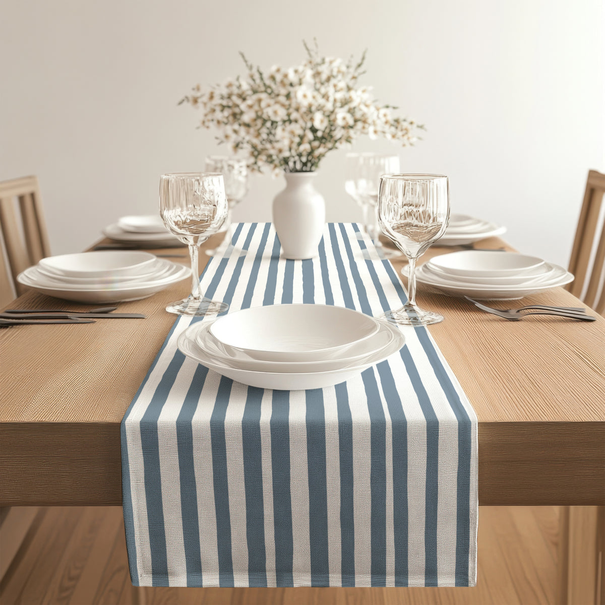 Minimalist slate blue stripe table runner adding a contemporary touch to a neutral dining setting