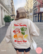 Cosy Sand crewneck sweatshirt with Slow Sunday Brunch Club brunch graphic