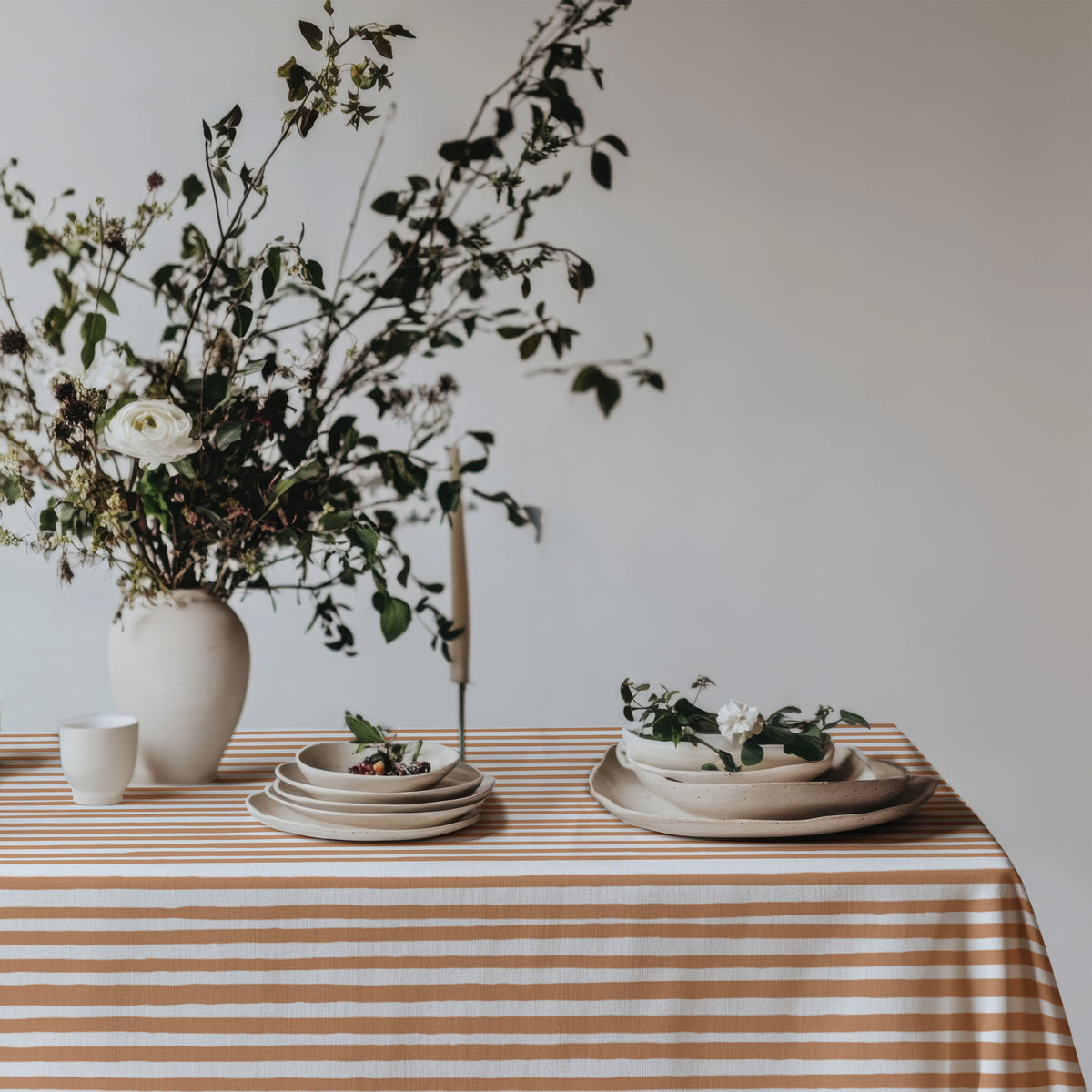 Detailed view of the 100% cotton twill fabric and subtle hand-drawn stripe pattern in soft terracotta and ivory.