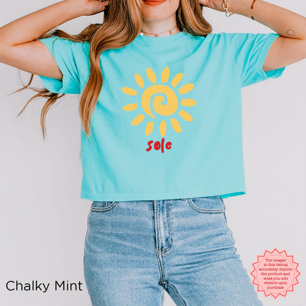 Styled summer look: Woman wearing the SOLE graphic tee with linen trousers, sunglasses and gold jewellery for an effortless summer outfit.