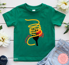 Kelly green kids “Tutto Bene” pasta lover T-shirt with bold spaghetti illustration and red script lettering, funny Italian food graphic tee for toddlers and children.