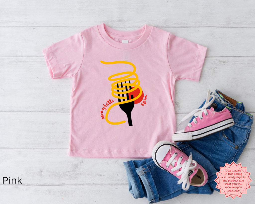 Pink toddler “Tutto Bene” spaghetti shirt featuring playful pasta artwork and red handwritten text, fun Italian themed kids graphic T-shirt.