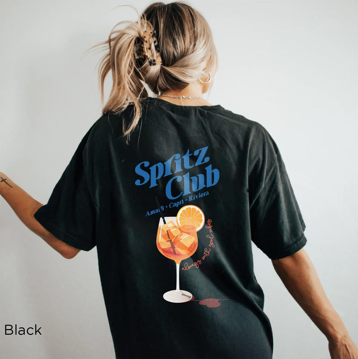 Back of Spritz Club graphic T-shirt showing colorful spritz cocktail illustration with Mediterranean summer-inspired design