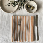 100% cotton twill table napkin with a terracotta striped print, perfect for modern dining décor.