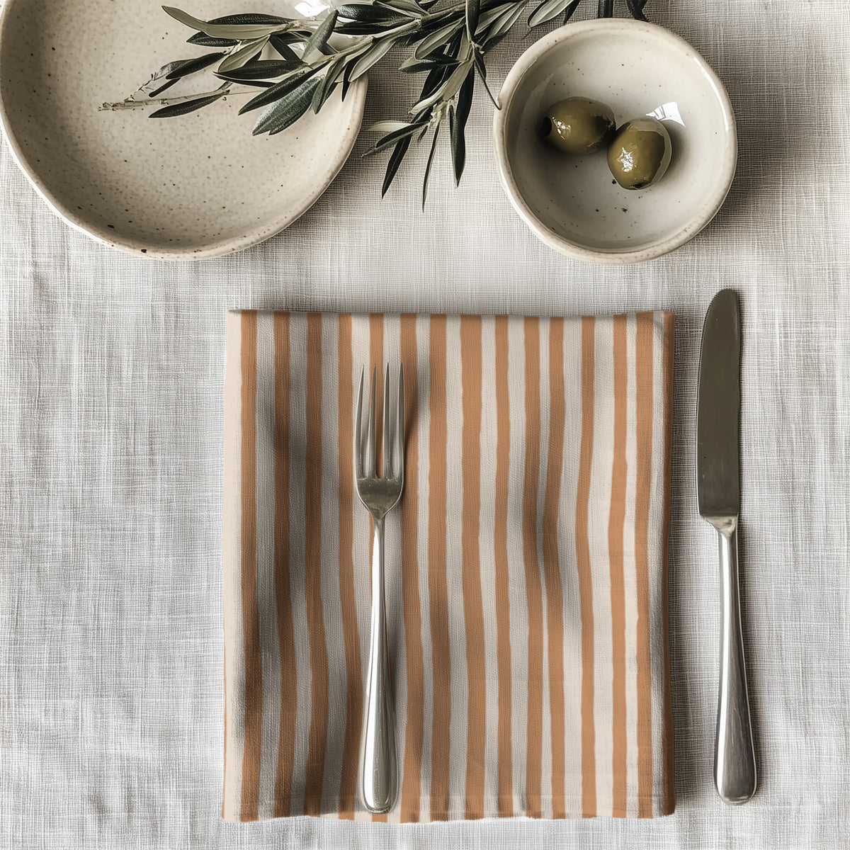 100% cotton twill table napkin with a terracotta striped print, perfect for modern dining décor.