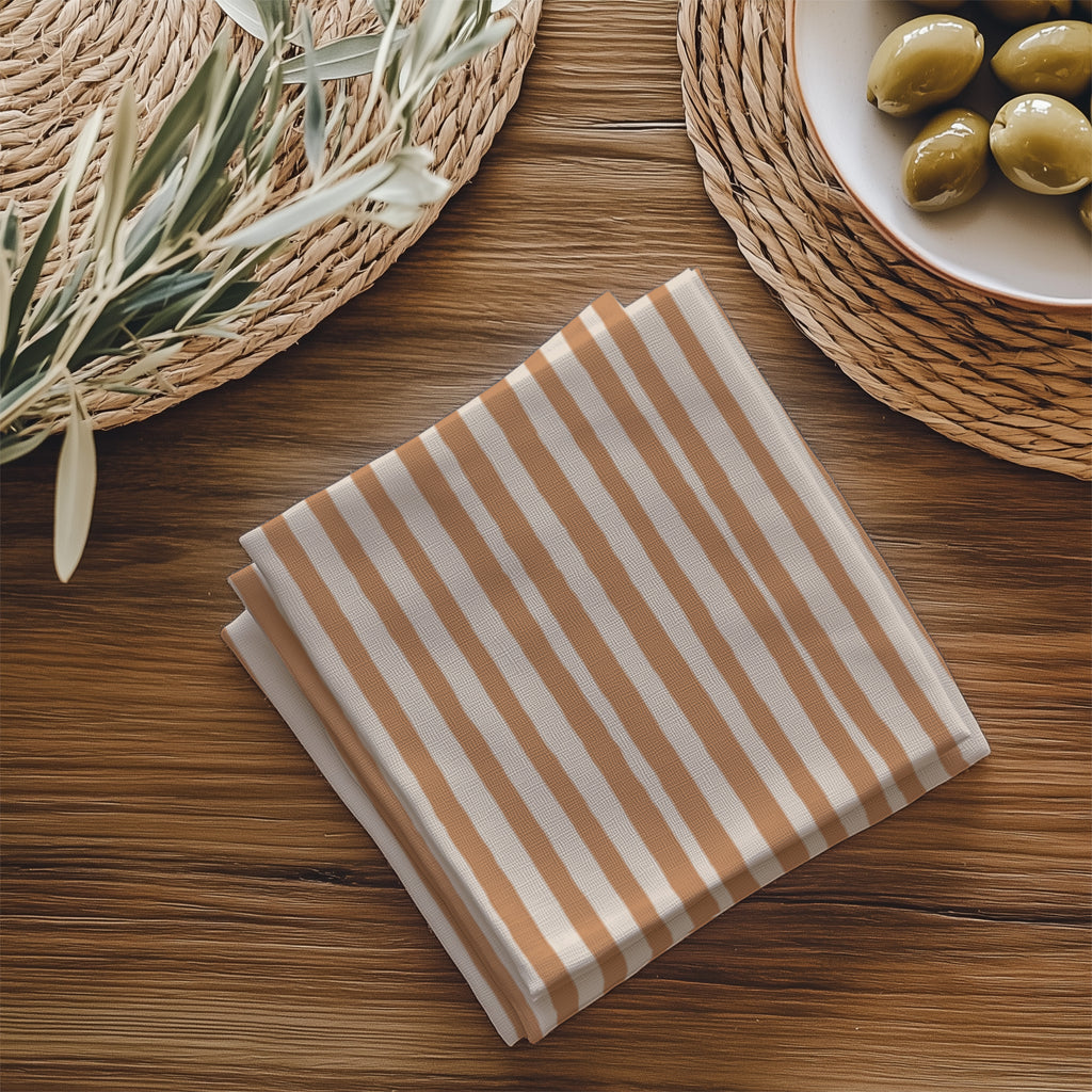 Close-up of the terracotta striped, fade-resistant print on a 100% cotton twill napkin.
