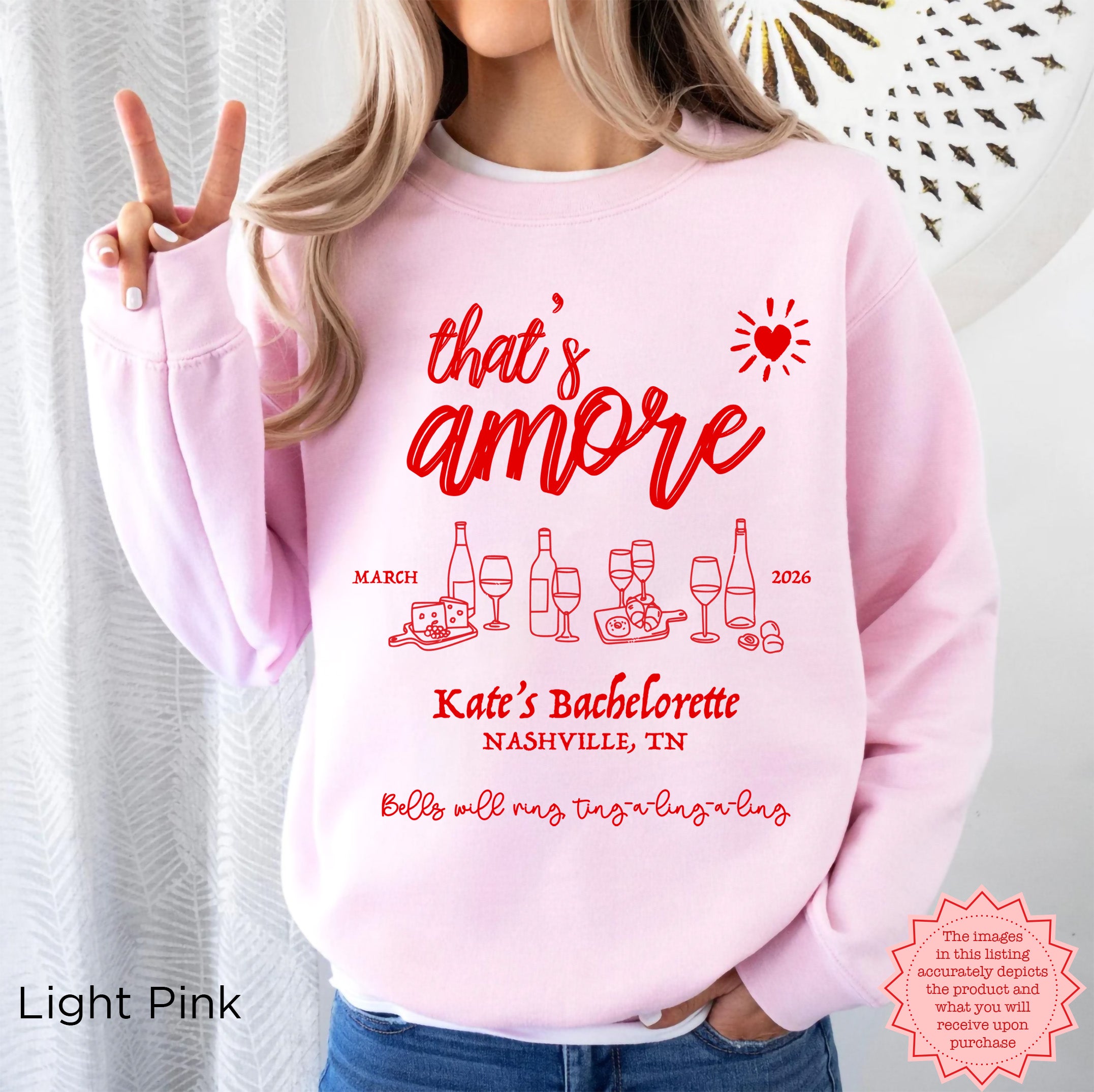Custom ‘That’s Amore’ Bachelorette Sweatshirt in Light Pink, personalized with bride’s name, location, and year.