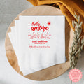 Personalized That's Amore bachelorette napkin with custom bride's name, event date, and location for an Italian-themed celebration.