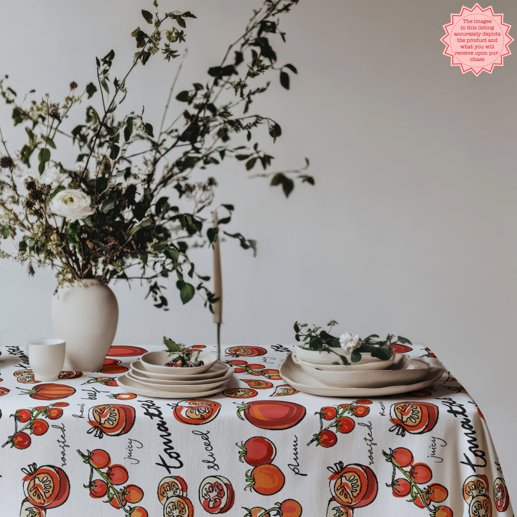 Cotton twill tomato tablecloth close up showing vibrant red tomato illustrations