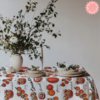 Cotton twill tomato tablecloth close up showing vibrant red tomato illustrations