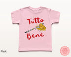Cute pink kids “Tutto Bene” spaghetti shirt featuring pasta fork illustration and red script text, fun Italian food graphic tee for toddlers and youth.