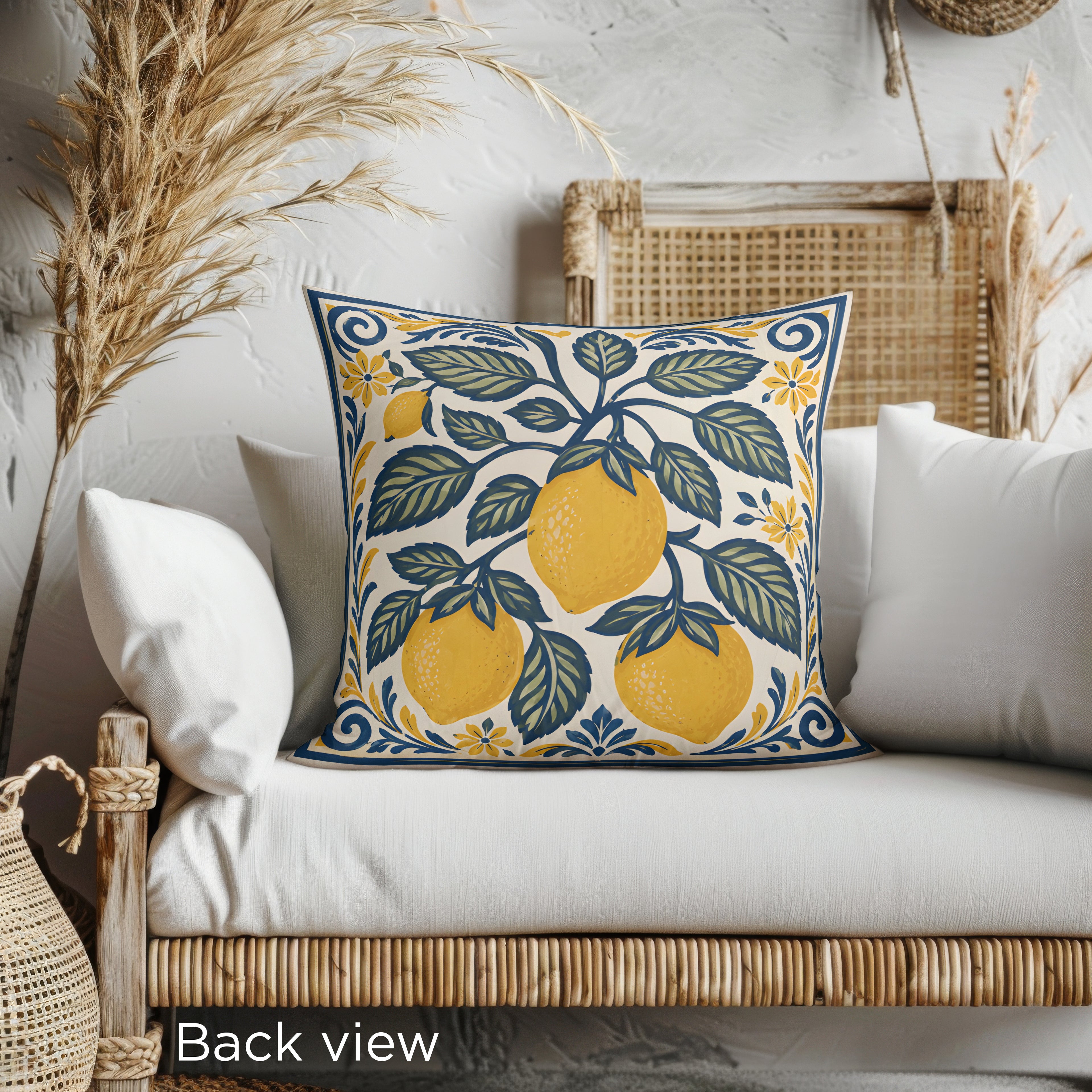 Square decorative pillow with Mediterranean lemon tree artwork styled for modern coastal interiors.
