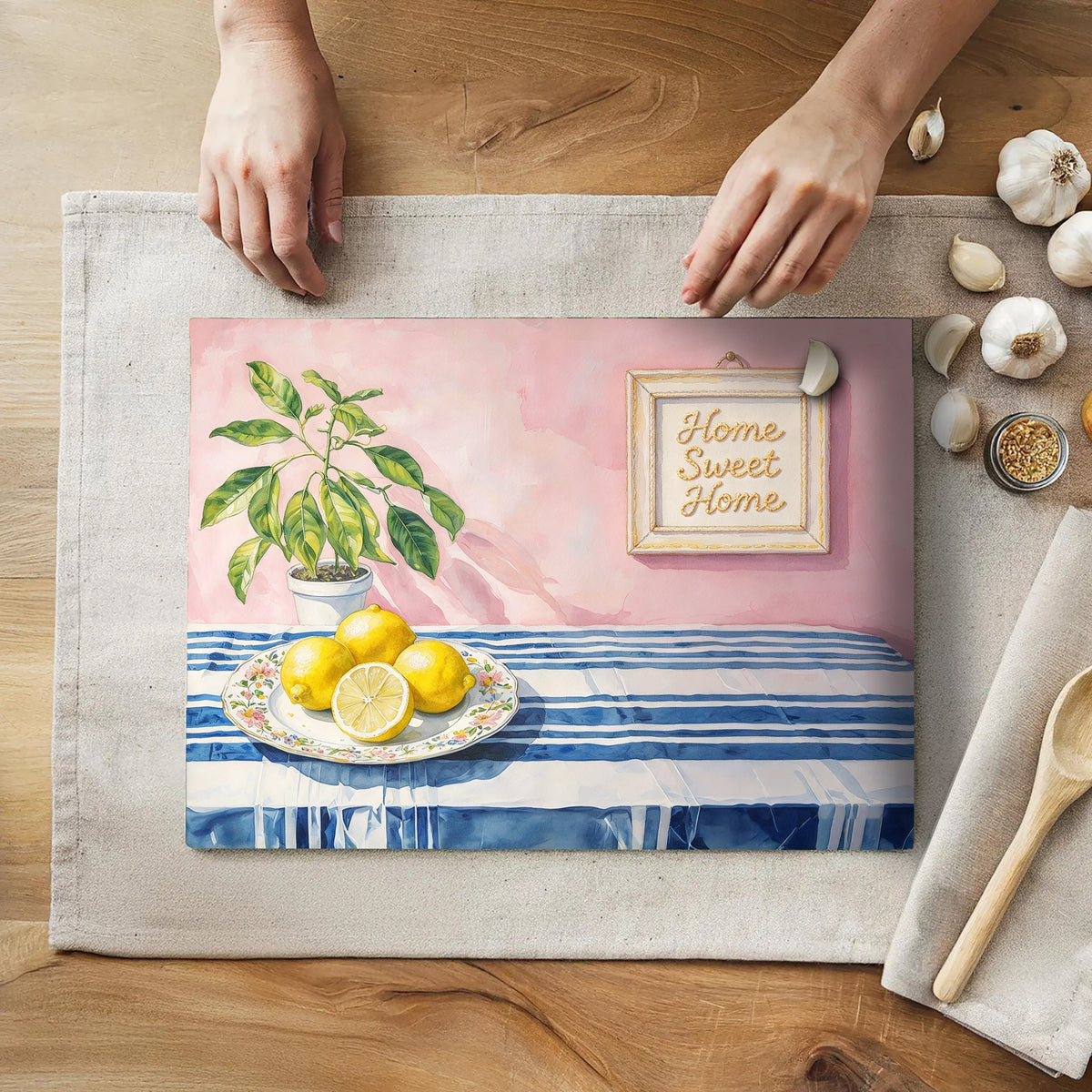 Watercolor lemon glass cutting board with blue stripes, pink background and botanical artwork by Rebbella.