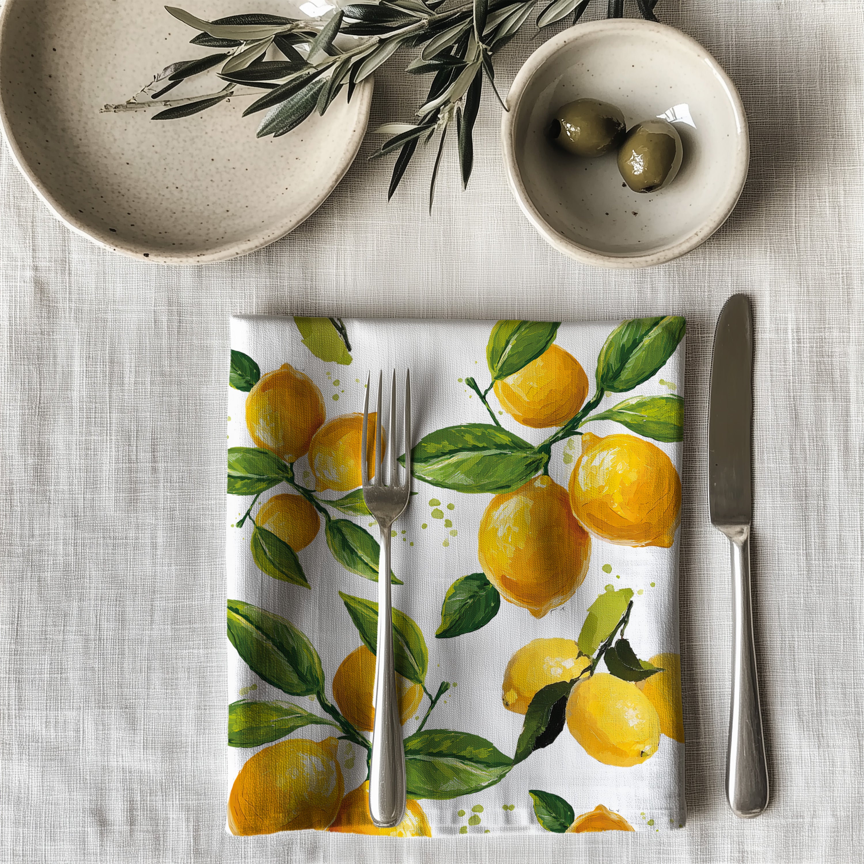 Single watercolor lemon dinner napkin folded on table showcasing one-sided print design and soft reusable cotton fabric