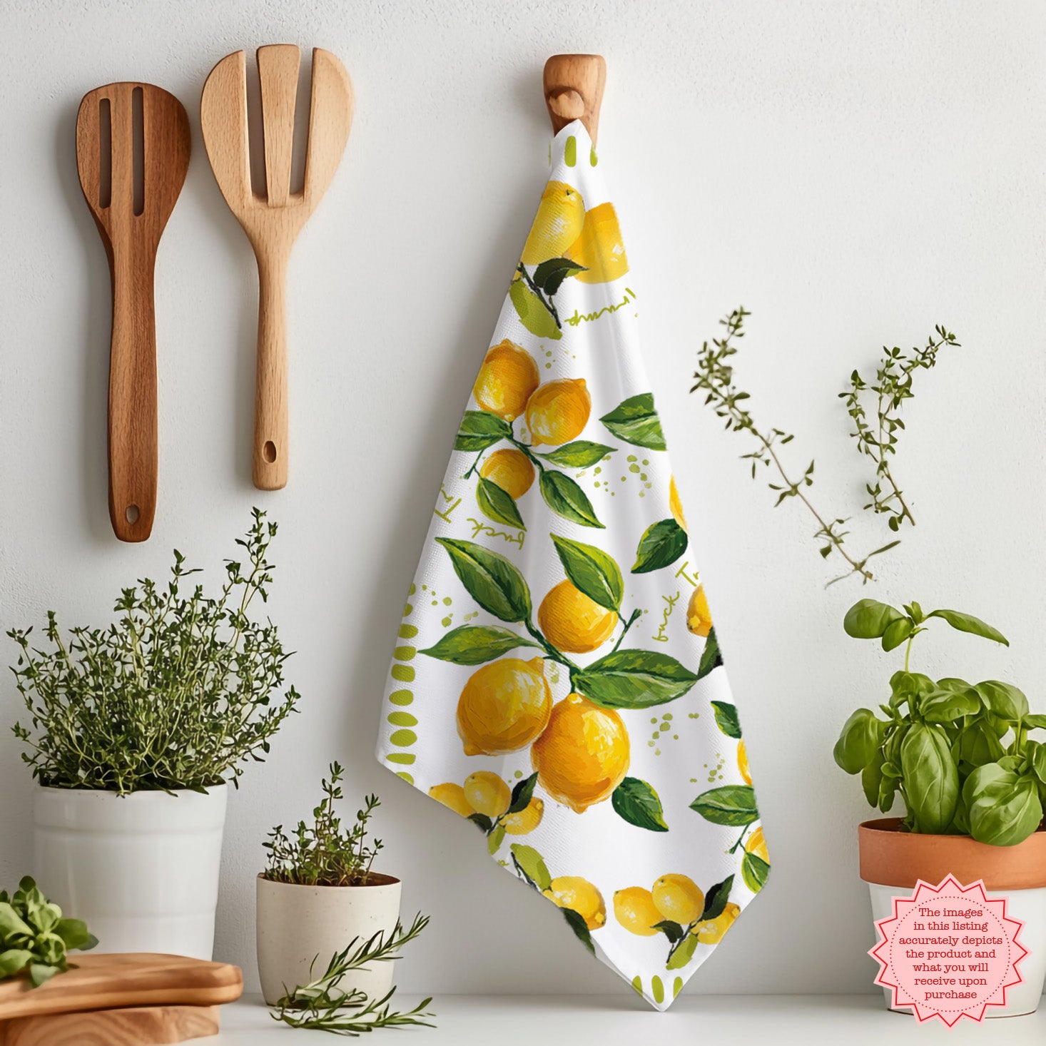Watercolor lemon kitchen towel laid flat on marble surface with eggs, herbs, and olive oil