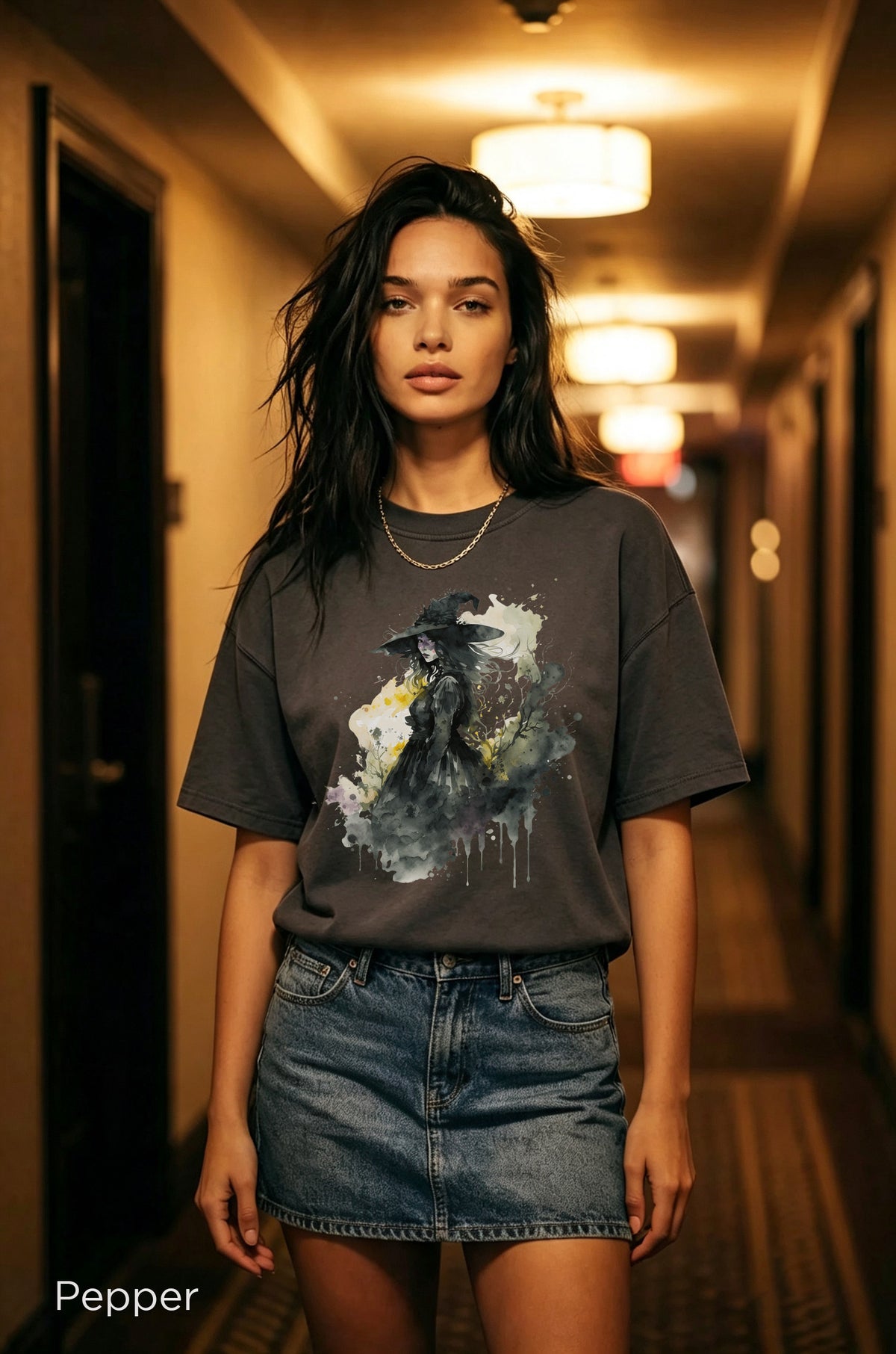 Moonlit Witch Halloween shirt with watercolor witch silhouette graphic printed on a Pepper vintage style Comfort Colors tee